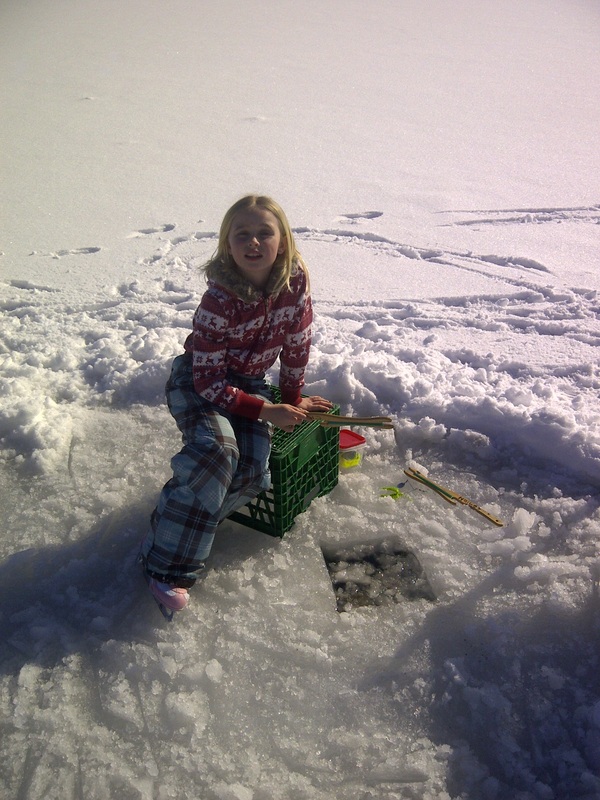 Catching more fish than her brothers at Cottage For Rent Ontario Winter Vacation.